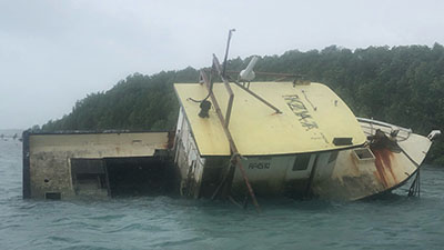 A boat partially sunken in the water
