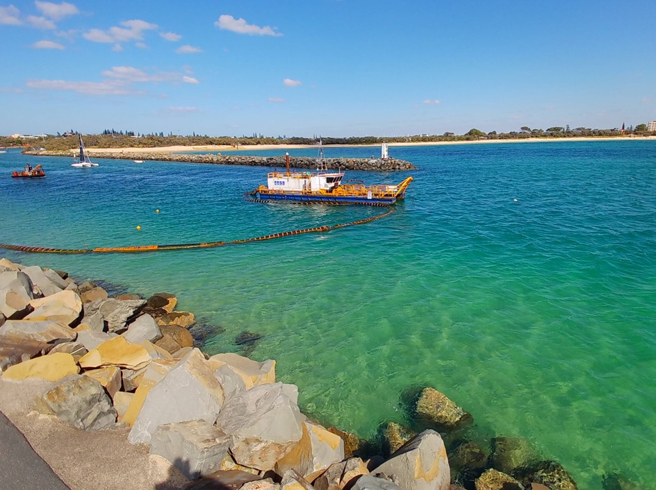 Active dredging in the channel with pipeline connected at Mooloolaba