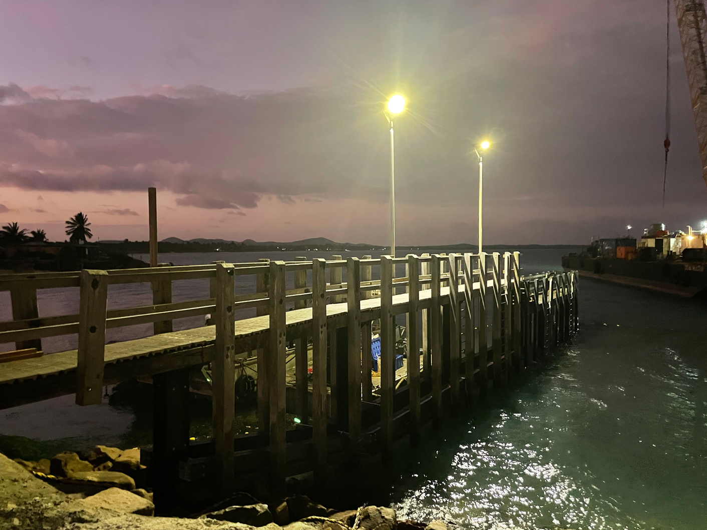 Repaired jetty at night with operational lights