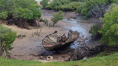 A broken boat in the water